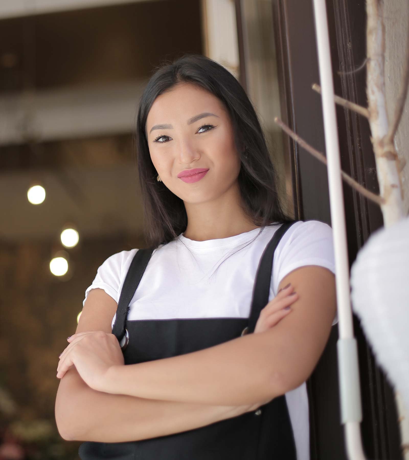 Woman Standing with her Arms Crossed Woman Standing with her Arms Crossed